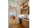 Charming bar area with wine cooler, sleek countertops, and stylish cabinets in a brightly lit home at 2179 Marann Ne Dr, Atlanta, GA 30345