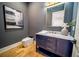 Modern powder room featuring stylish vanity with marble countertop and contemporary fixtures at 2179 Marann Ne Dr, Atlanta, GA 30345