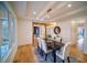 Bright dining room with hardwood floors, stylish lighting, and large windows at 2179 Marann Ne Dr, Atlanta, GA 30345