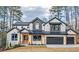 Beautiful two-story home with modern farmhouse architecture, a two-car garage, and manicured landscaping at 2179 Marann Ne Dr, Atlanta, GA 30345