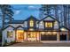 Charming two-story home with a well-lit exterior, accentuating the modern farmhouse design and inviting ambiance at 2179 Marann Ne Dr, Atlanta, GA 30345