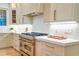 Kitchen area featuring modern appliances, including a stove and oven, and stylish white countertops at 2179 Marann Ne Dr, Atlanta, GA 30345
