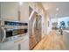 Modern kitchen with stainless steel appliances, custom cabinets, and an open layout leading to the living area at 2179 Marann Ne Dr, Atlanta, GA 30345