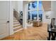 Sunlit living room with high ceilings, large windows, and open staircase at 2179 Marann Ne Dr, Atlanta, GA 30345