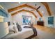 Comfortable primary bedroom with vaulted ceilings, exposed beams, and great natural light at 2179 Marann Ne Dr, Atlanta, GA 30345