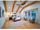 Serene primary bedroom with vaulted ceiling, wood beams, and hardwood floors at 2179 Marann Ne Dr, Atlanta, GA 30345
