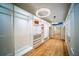 Spacious walk-in closet with custom shelving, drawers, hardwood floors, and modern lighting at 2179 Marann Ne Dr, Atlanta, GA 30345
