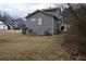 Side view of a gray two-story home on a spacious lawn at 3934 Conley Downs Ln, Decatur, GA 30034