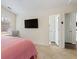 Comfortable bedroom with ceiling fan, ample storage and soft carpet at 3934 Conley Downs Ln, Decatur, GA 30034