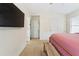 Spacious bedroom with ceiling fan, adjoining doors and comfortable carpet at 3934 Conley Downs Ln, Decatur, GA 30034