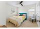 Bright bedroom with a comfortable bed, stylish decor, and a ceiling fan for added comfort at 3934 Conley Downs Ln, Decatur, GA 30034