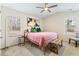 Cozy bedroom with ceiling fan, natural light, and a warm, inviting atmosphere at 3934 Conley Downs Ln, Decatur, GA 30034
