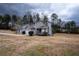 Charming two-story home with a well-maintained lawn, a garage, and a welcoming front porch at 3934 Conley Downs Ln, Decatur, GA 30034