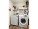 Bright laundry room with modern washer and dryer, plus wire shelving for organization at 3934 Conley Downs Ln, Decatur, GA 30034