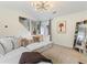 Bright and cozy living room with plush seating, modern light fixture and stylish decorations at 3934 Conley Downs Ln, Decatur, GA 30034