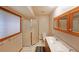 Bathroom featuring a glass enclosed shower, dual sinks and tiled floors at 1072 Powell Wright Rd, Marietta, GA 30066