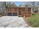 Charming home featuring a two-car garage, a cozy deck, and a well-maintained front yard at 1072 Powell Wright Rd, Marietta, GA 30066