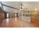 Spacious living area with a stone fireplace, exposed wood beams, and modern appliances at 1072 Powell Wright Rd, Marietta, GA 30066