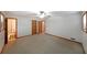 Spacious bedroom with plush carpeting, closet, and multiple doorways at 1072 Powell Wright Rd, Marietta, GA 30066