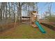 Backyard wooden playset featuring swings, slide, and playhouse, providing hours of entertainment at 1072 Powell Wright Rd, Marietta, GA 30066