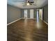 Spacious main bedroom featuring hardwood style flooring, with ample closet space at 163 Woodwind Way, Jonesboro, GA 30238