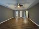 Large main bedroom featuring trey ceiling with a fan, and multiple doorways at 163 Woodwind Way, Jonesboro, GA 30238