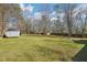 A very large backyard featuring an outbuilding and full perimeter fencing at 55 Sunset Rd, Mcdonough, GA 30253