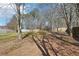 Mature trees shade the backyard of this property at 55 Sunset Rd, Mcdonough, GA 30253