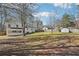 A large, fenced backyard that features a storage shed and nice lawn at 55 Sunset Rd, Mcdonough, GA 30253