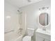 Bathroom featuring shower-tub combo and vanity with large mirror at 55 Sunset Rd, Mcdonough, GA 30253