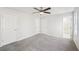 Bedroom with three doors, fresh paint, carpet and ceiling fan at 55 Sunset Rd, Mcdonough, GA 30253