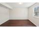Light-filled bedroom featuring hardwood floors and neutral paint at 55 Sunset Rd, Mcdonough, GA 30253