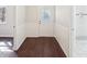 Hallway leading to the door and featuring view of the bathroom at 55 Sunset Rd, Mcdonough, GA 30253