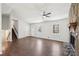 Open-concept living room featuring a cozy stone fireplace and hardwood floors at 55 Sunset Rd, Mcdonough, GA 30253
