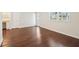 Spacious room with hardwood floors, and view of bonus nook and natural light at 55 Sunset Rd, Mcdonough, GA 30253