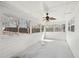 Screened porch with ceiling fan, white washed walls, and views of backyard at 55 Sunset Rd, Mcdonough, GA 30253