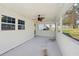Spacious screened porch with ceiling fan, perfect for outdoor enjoyment at 55 Sunset Rd, Mcdonough, GA 30253