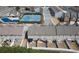 Aerial view of townhomes with private backyards, tennis courts, and community pool in the neighborhood at 3318 Sardis Bend Dr, Buford, GA 30519