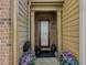 Inviting entryway with potted plants, a modern door, and decorative accents at 3318 Sardis Bend Dr, Buford, GA 30519