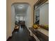 Stylish hallway features dark hardwood floors, an arched doorway, and access to the living area at 3318 Sardis Bend Dr, Buford, GA 30519