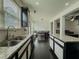 Bright kitchen boasts a double sink, granite countertops, and a convenient island for meal preparation at 3318 Sardis Bend Dr, Buford, GA 30519