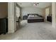 Spacious main bedroom features a high ceiling, natural light, and carpet flooring, creating a cozy retreat at 3318 Sardis Bend Dr, Buford, GA 30519