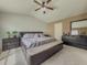 Bright main bedroom boasts a ceiling fan and carpet flooring, enhancing the room's comfort and style at 3318 Sardis Bend Dr, Buford, GA 30519