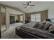 Stylish main bedroom features a ceiling fan, large windows, and carpet flooring, providing a comfortable space at 3318 Sardis Bend Dr, Buford, GA 30519