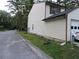 Side view of home showing vinyl siding, grass and curb at 402 Pine Tree Trl, Atlanta, GA 30349