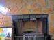 Stone fireplace with metal grate adds rustic charm to the living space at 402 Pine Tree Trl, Atlanta, GA 30349