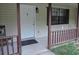 Front porch featuring a white door, dark trim, and a small welcome mat at 402 Pine Tree Trl, Atlanta, GA 30349