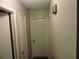 Hallway with multiple doors offering seamless access to various rooms within the home at 402 Pine Tree Trl, Atlanta, GA 30349