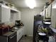 Compact kitchen featuring updated stainless steel appliances and ample counter space for meal prep at 402 Pine Tree Trl, Atlanta, GA 30349