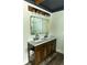 Tastefully decorated bathroom showcasing a double vanity, a framed mirror, and modern lighting at 793 Round Tree Ct, Lawrenceville, GA 30045